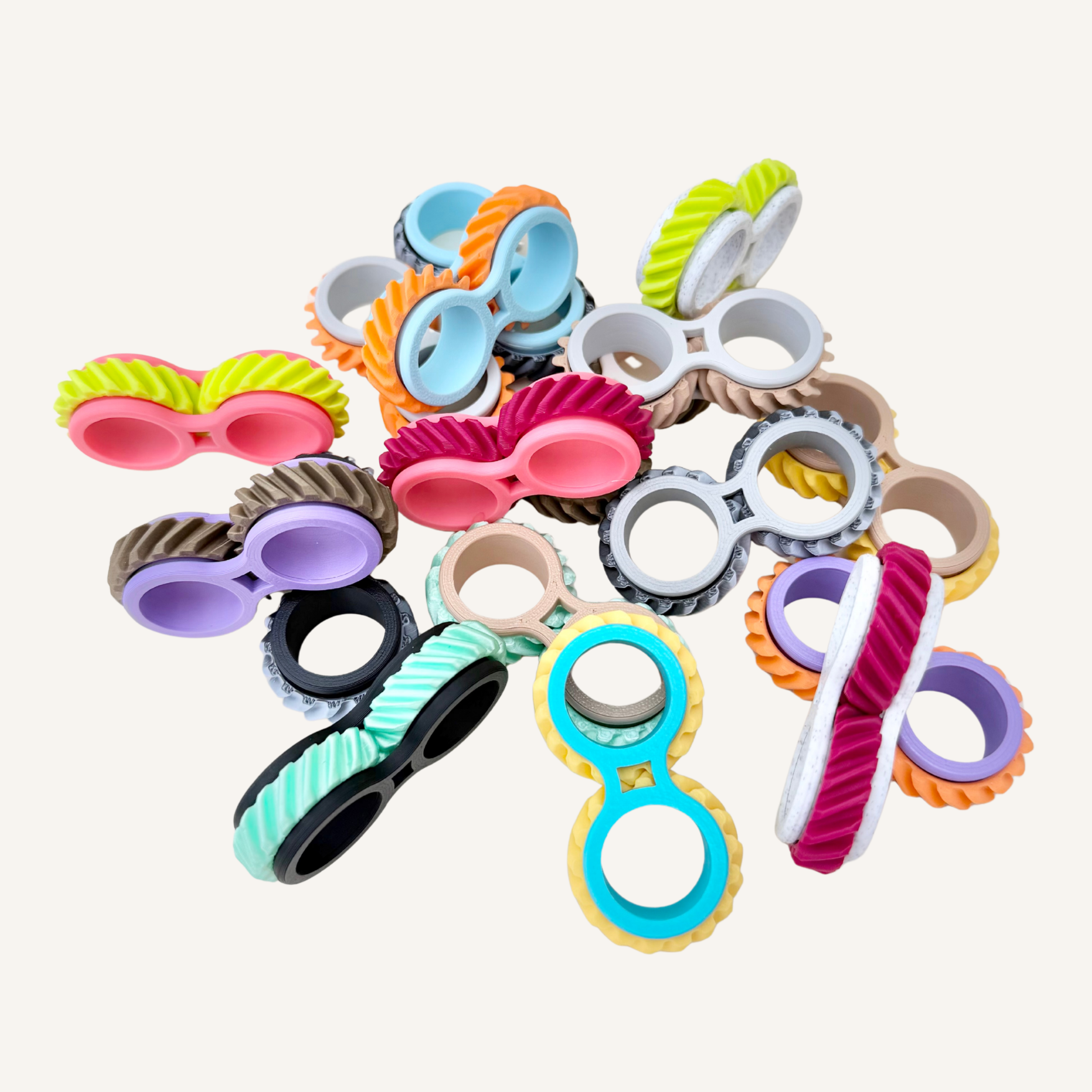 Quiet two-finger rolling fidget with textured wheels for tactile feedback, focus support and sensory regulation.