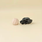 Palm-sized spiral fidget designed for twisting, tracing textures, and grounding sensory play.
