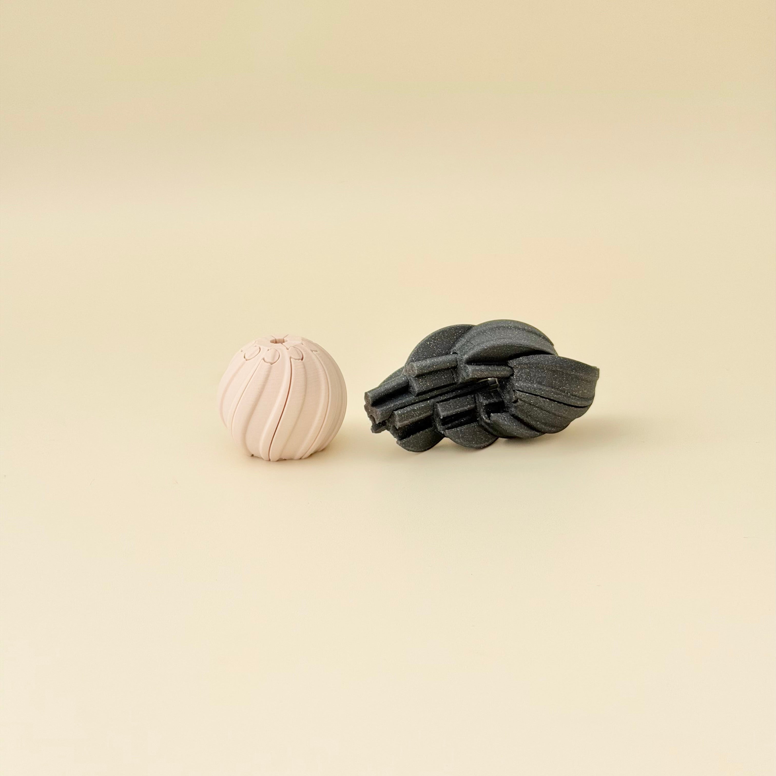 Palm-sized spiral fidget designed for twisting, tracing textures, and grounding sensory play.
