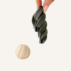Small spiral twist sensory fidget with ridged texture and a satisfying rotating motion for tactile stimming.
