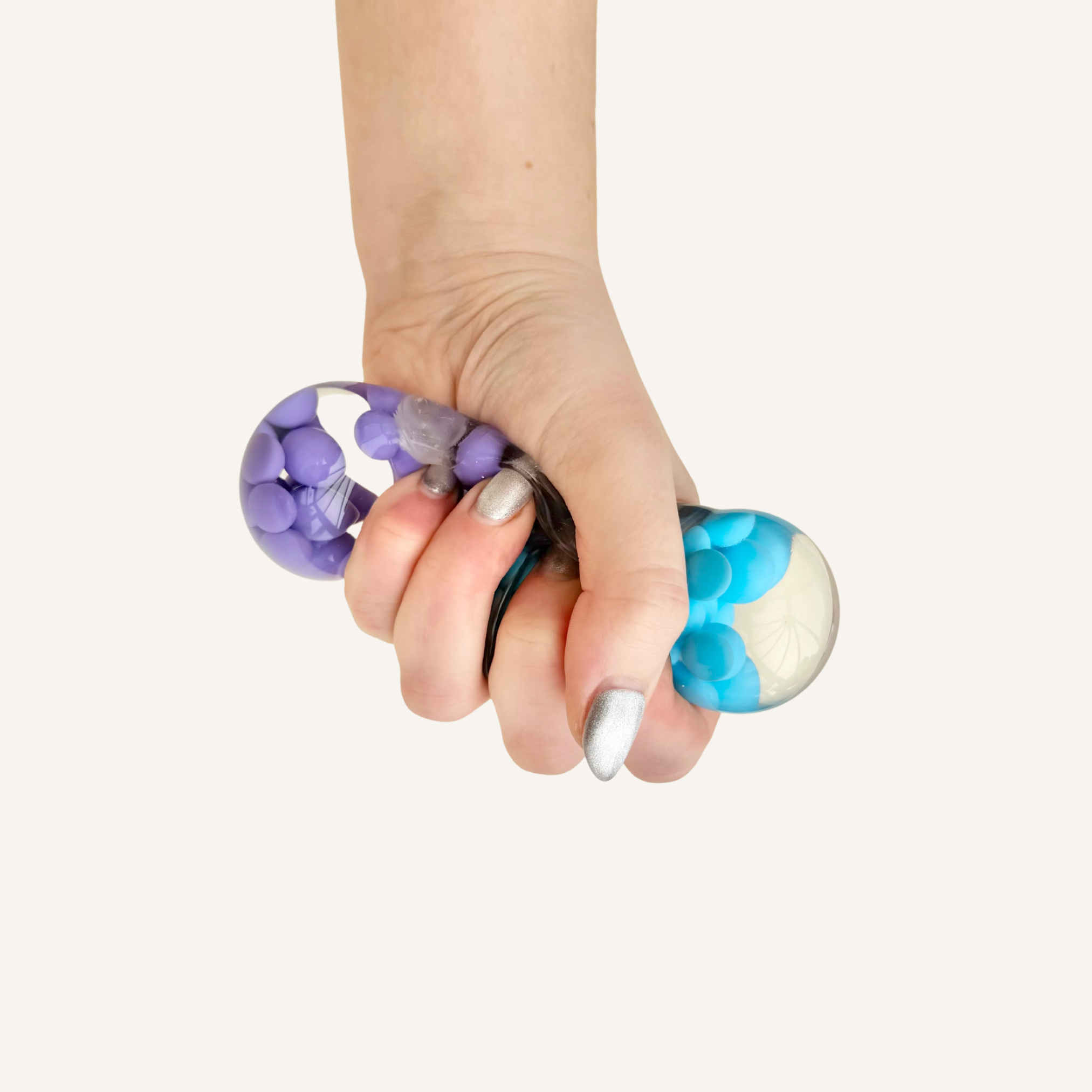 Dual colour sensory squish ball with water and beads inside, made for tactile input, grounding and everyday hand stimulation.
