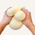 Chunky sensory squeeze toy with soft, pliable feel and comforting resistance for stress relief and fidgeting.