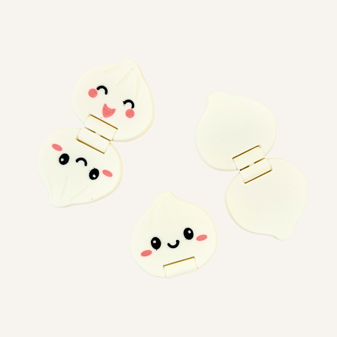 Small dumpling-inspired fidget with flip movement for busy hands, stimming and focus support.