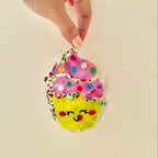 Flexible liquid fidget filled with glitter and shapes for visual stimulation and gentle tactile feedback.
