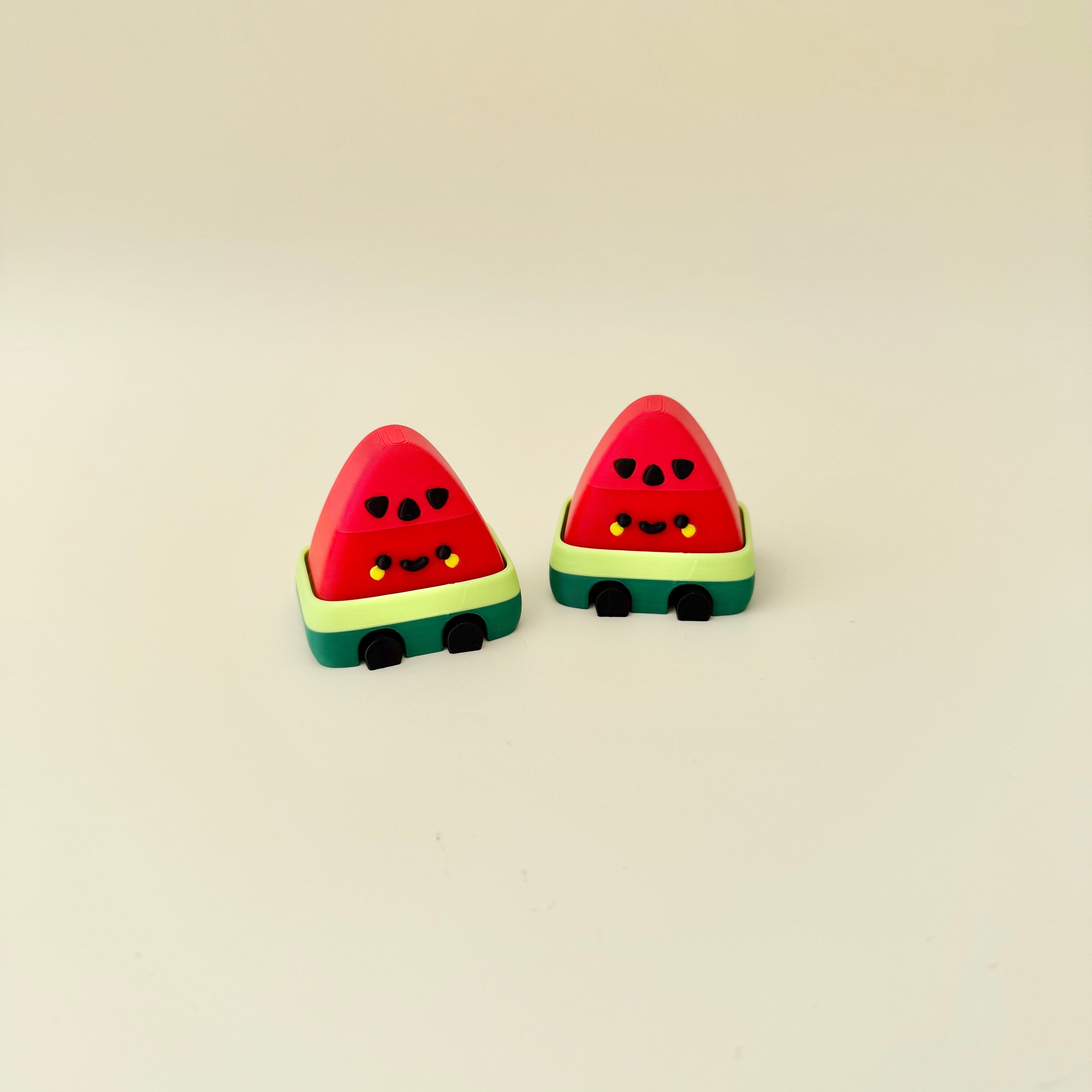 Small watermelon desk fidget with click or quiet click option for stimming and focus support.