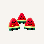 Cute watermelon sensory clicker with pressable red top, dangly legs and tactile feedback for busy hands.
