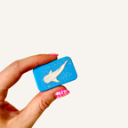 Matching magnetic fidget pair featuring the colourful Wildly Unhinged design with raised glossy artwork.