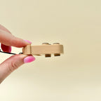 Portable pop fidget with wrist strap, bubble press action and neurodivergent-friendly sensory support.