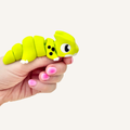 Small lime green articulated dragon fidget with smooth movement for busy hands and sensory regulation.