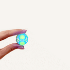 Rainbow glow in the dark Zorble Pop Back sensory fidget with a colourful gradient finish.