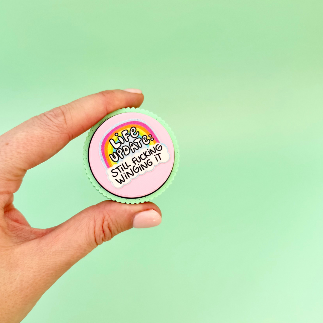 Colourful adult sensory clicker with tactile ridged edge and press down clicking action.
