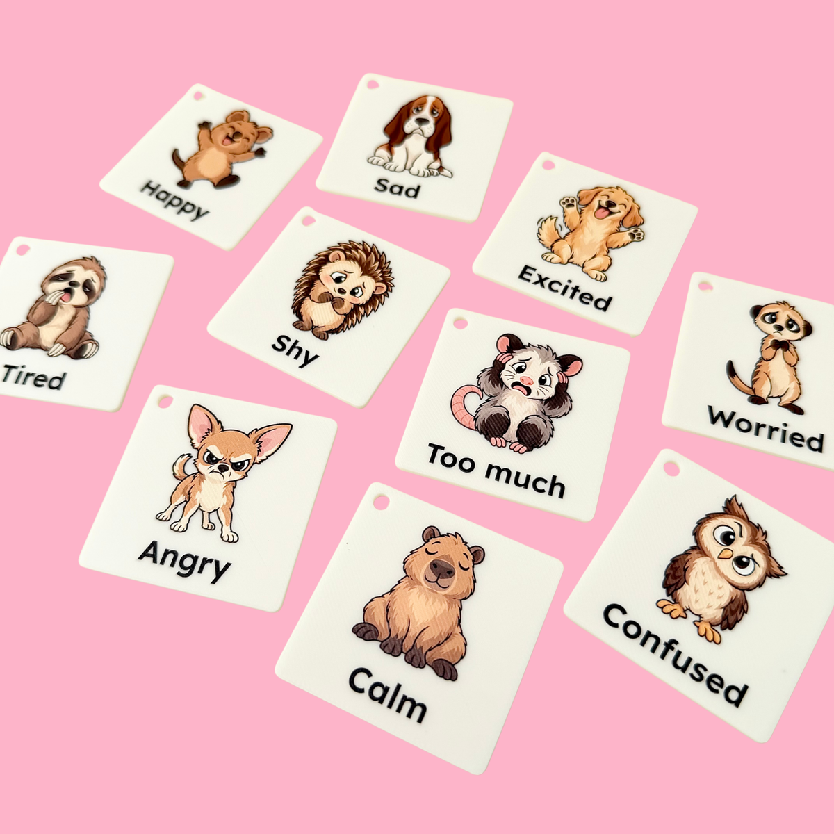 Full-colour Animal Feelings COMMZ tiles showing different emotions including happy, sad, worried, angry, calm and excited.