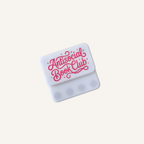 White and pink magnetic sensory fidget pair with a playful book club design for adult readers.