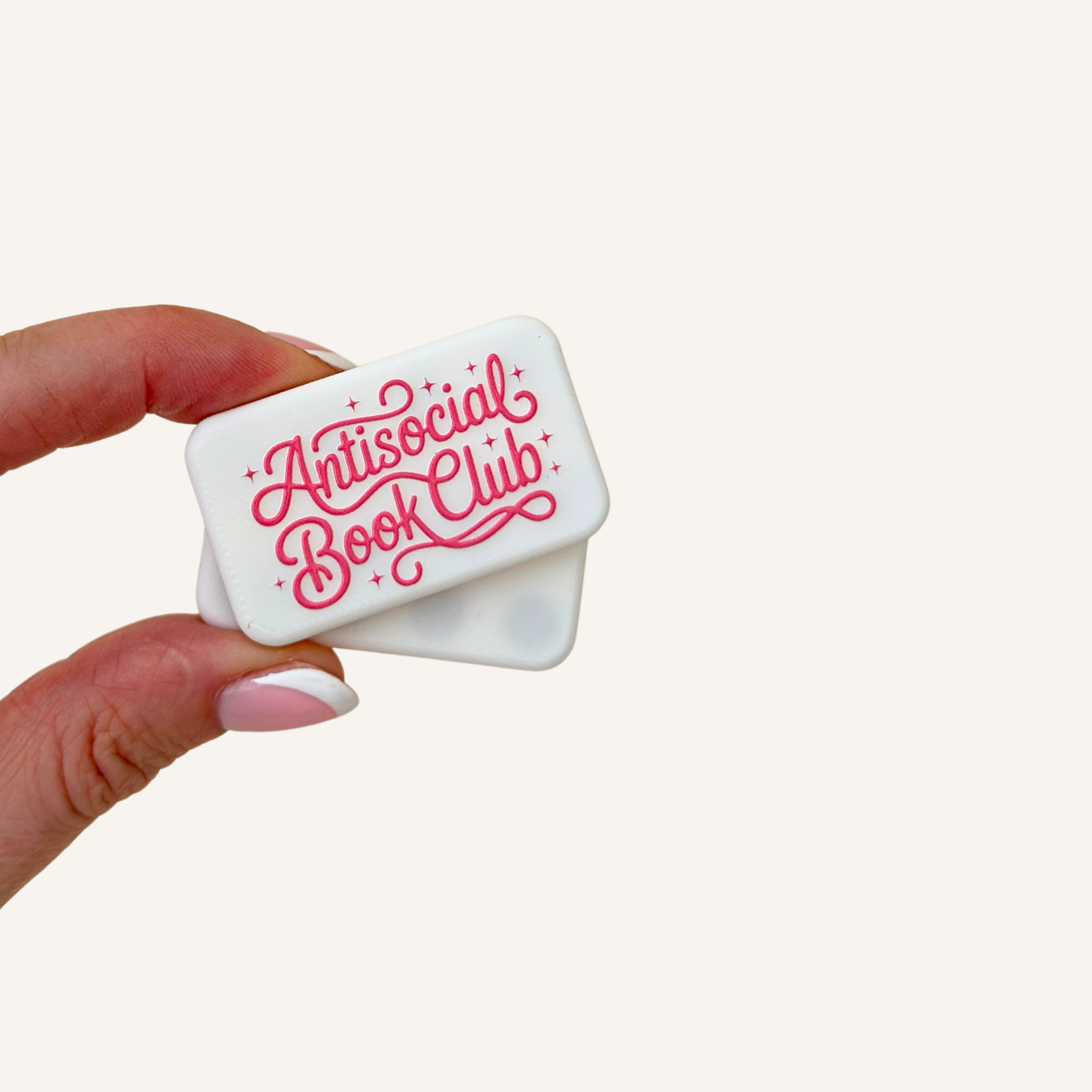 White magnetic fidget pair designed for repetitive snapping, twisting and one-handed sensory movement.