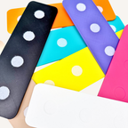 Reusable visual board arranged with communication tiles for displaying everyday choices and needs.