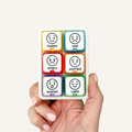 COMMZ Click emotions communication tool featuring six colour-coded clickers with interchangeable visual emotion symbols.
