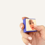 Personalised photo fidget with a smooth raised image and tactile ridged outer edge for repetitive clicking.