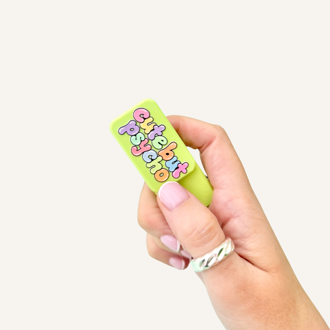 Cute But Psycho 3D printed pocket magnets in bright lime green, a fun magnetic fidget for sliding, twisting and snapping together.
