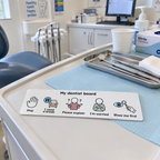 Portable visual communication board designed to support communication during a dental appointment.