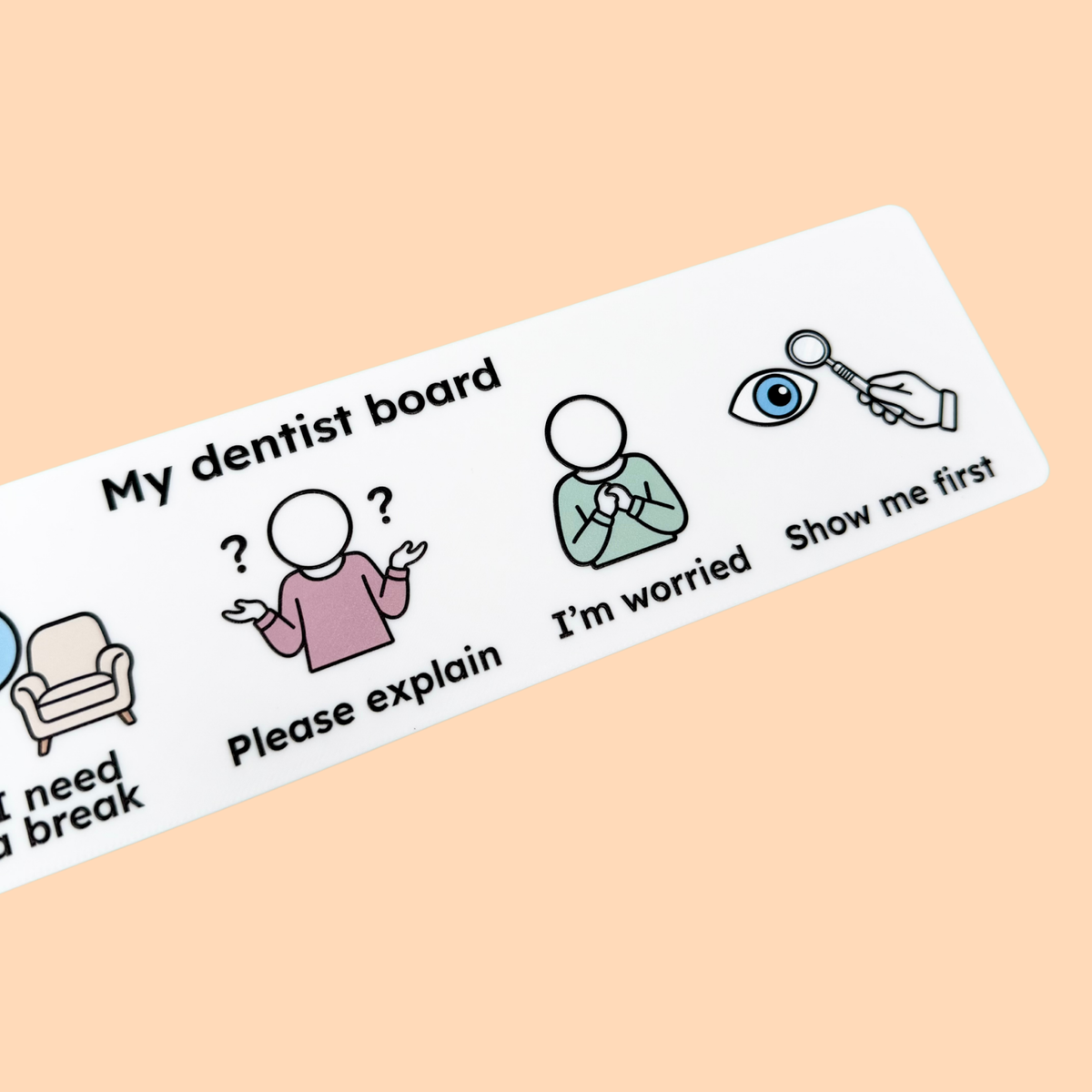Child holding a Dentist Communication Board in a dental waiting room.