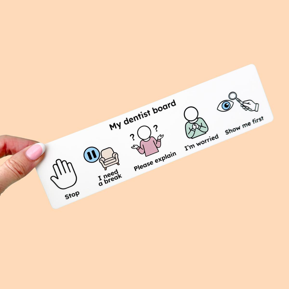 Child using the Stimz Dentist Communication Board in a dental waiting room before an appointment.