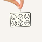 Portable emotion communication board with six high-contrast facial expressions for showing feelings.
