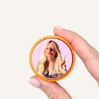 Custom photo clicker featuring a funny facial expression, perfect for personalised gifts and everyday fidgeting.