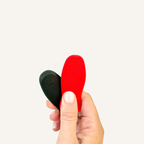 Two magnetic skateboard-inspired fidgets designed to slide against each other and snap back together.