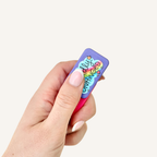 Handheld magnetic fidget with raised tactile artwork and satisfying pull-apart and snap-together feedback.