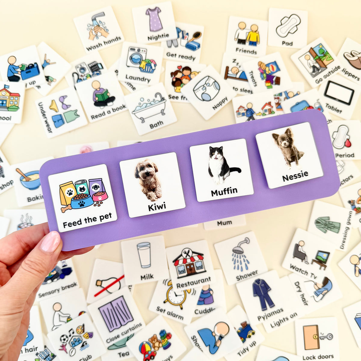 Communication board showing a mixture of 3D and Full-Colour COMMZ attached using Velcro.