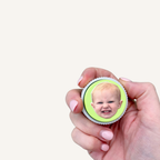 Square personalised sensory clicker featuring a custom photograph and tactile ridged edges.