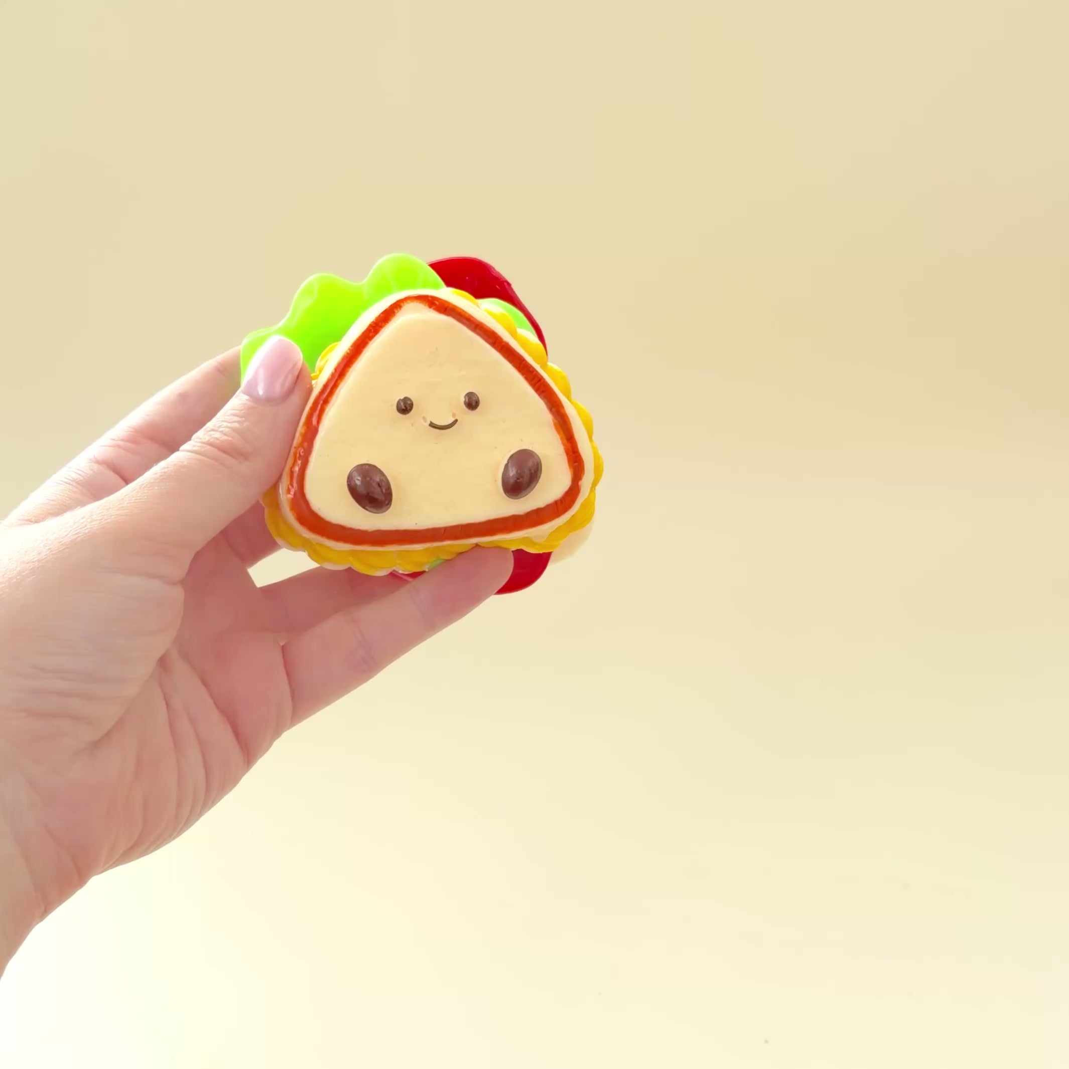 Palm-sized novelty squishy with satisfying resistance and a fun stacked shape for busy hands