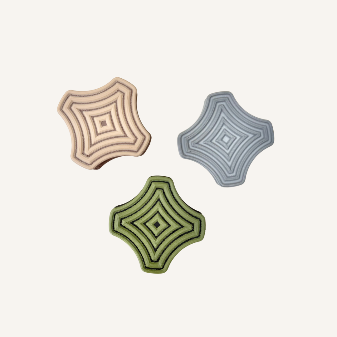 Strong magnetic sensory fidget pair with raised tactile ridges and bevelled edges for sliding, twisting and snapping movements.
