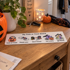 Portable visual communication board for trick or treating with five clear full-colour Halloween messages.